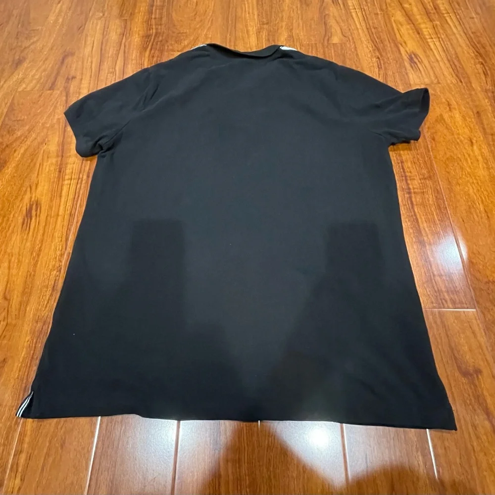Stylish Black Polo Shirt with White Accents - Picture 4 of 10